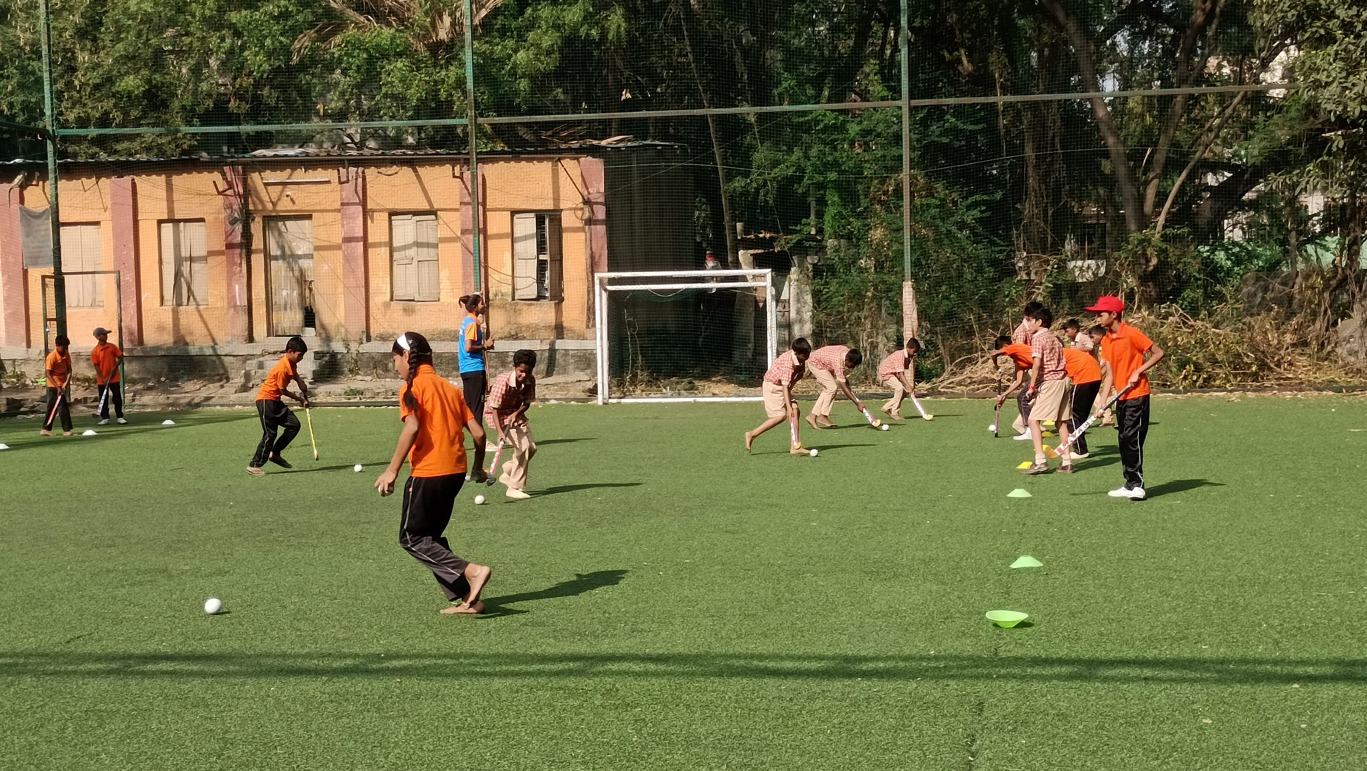 Student playing grassgroot hockey