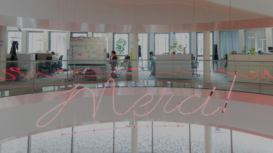 "Merci !" sign written in the office